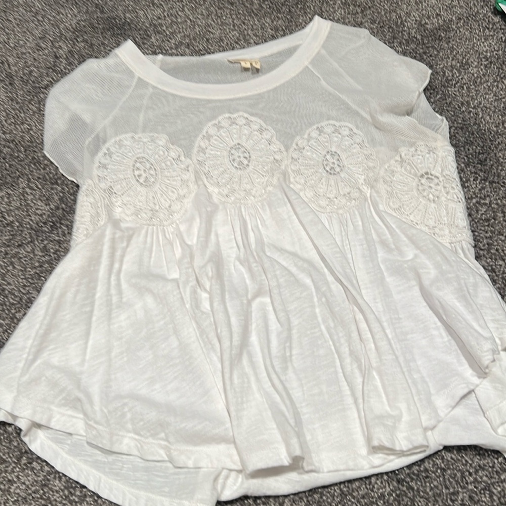 Beautiful tee with lots of detail. Very comfortable and easy to wear.